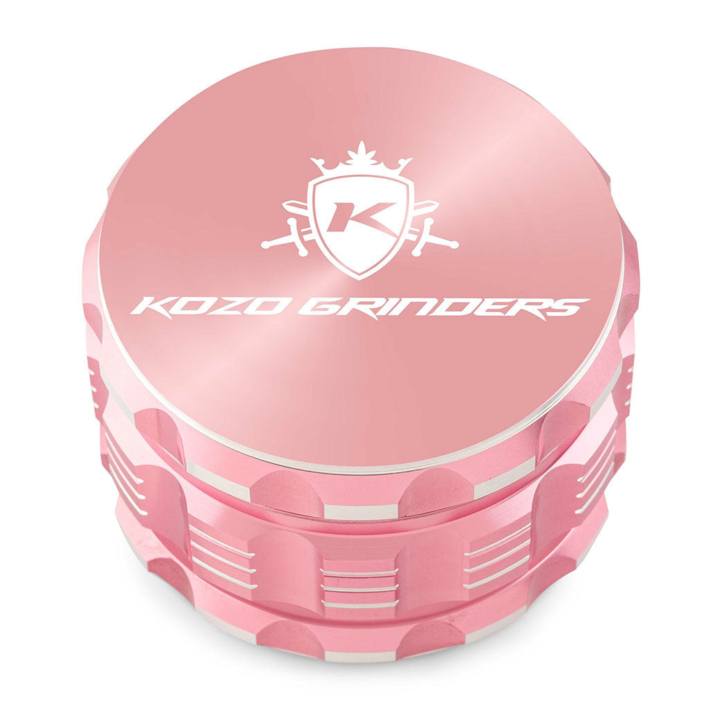 Kozo 3 inch four-piece anodized aluminum grinder in rose gold, closed front view of the body with the Kozo logo lid