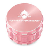 Kozo 3 inch four-piece anodized aluminum grinder in rose gold, closed front view of the body with the Kozo logo lid