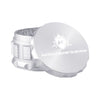 Kozo 3 inch four-piece anodized aluminum grinder in silver, lid tilted open beside the toothed grinding chamber