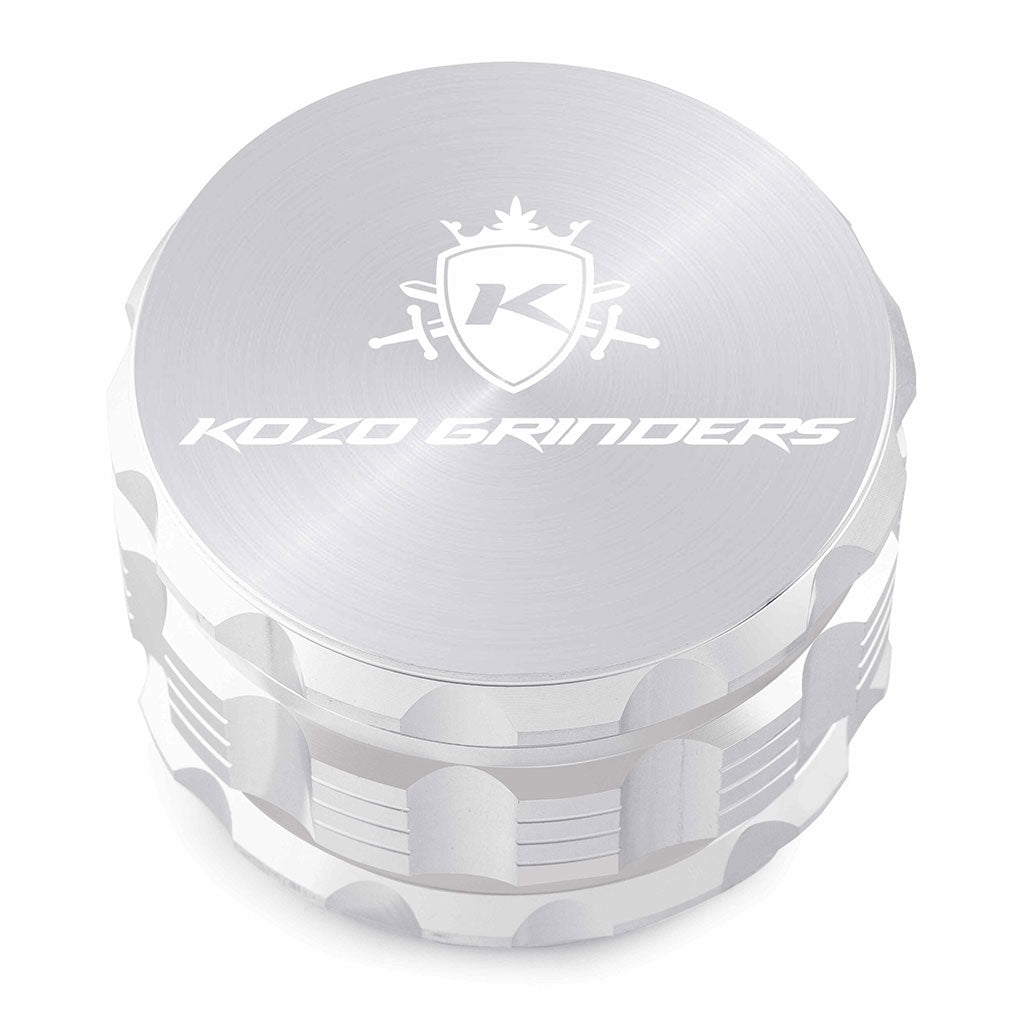 Kozo 3 inch four-piece anodized aluminum grinder in silver, closed front view of the body with the Kozo logo lid