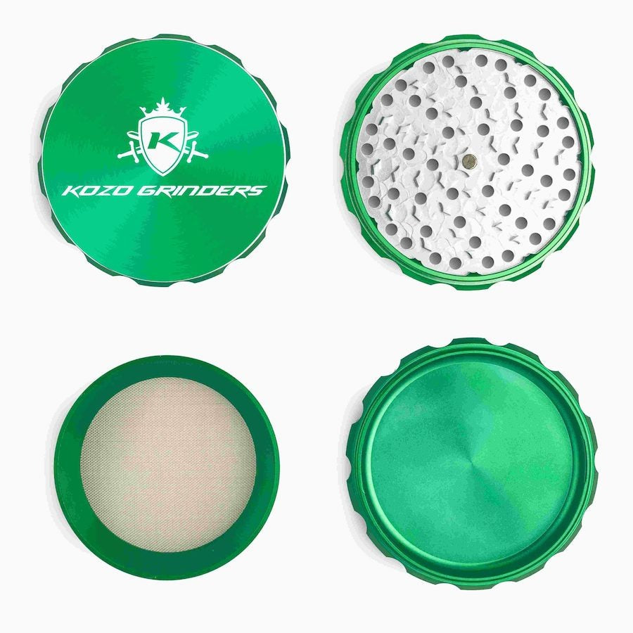 Kozo 4 inch four-piece anodized aluminum grinder in green, four pieces laid flat showing lid, teeth, screen and base