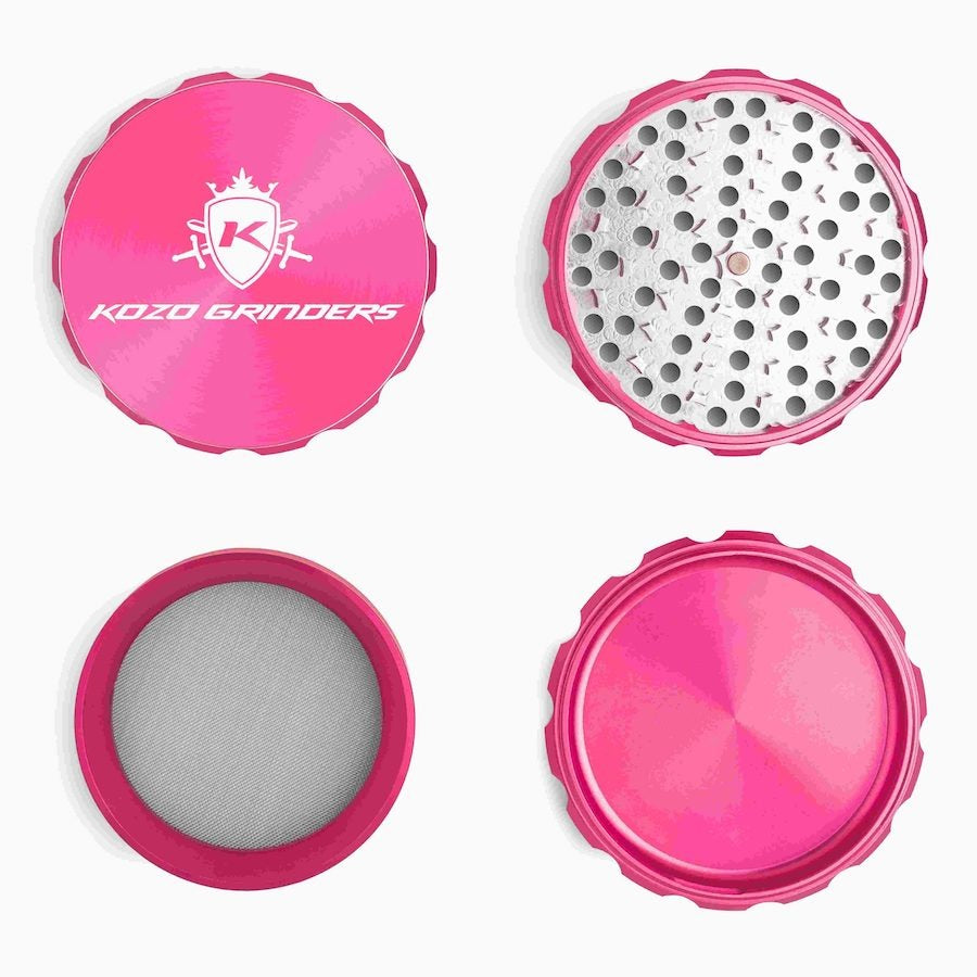 Kozo 4 inch four-piece anodized aluminum grinder in pink, four pieces laid flat showing lid, teeth, screen and base