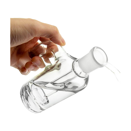 Hand holding PILOT DIARY 18mm Ash Catcher at 90 Degree angle, clear glass, isolated on white