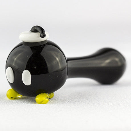 Empire Glassworks Bomber Spoon Pipe with intricate colored glass detailing, side view on white background