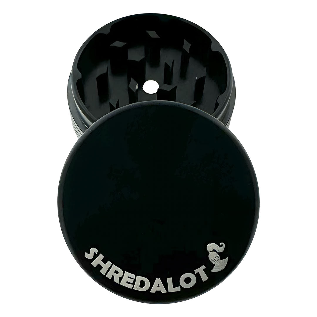 Sir Shredalot 2-Part Grinder in Black - Top View with Visible Teeth and Logo