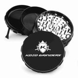 Kozo 4 inch four-piece anodized aluminum grinder in black, split into four pieces with the pollen scraper