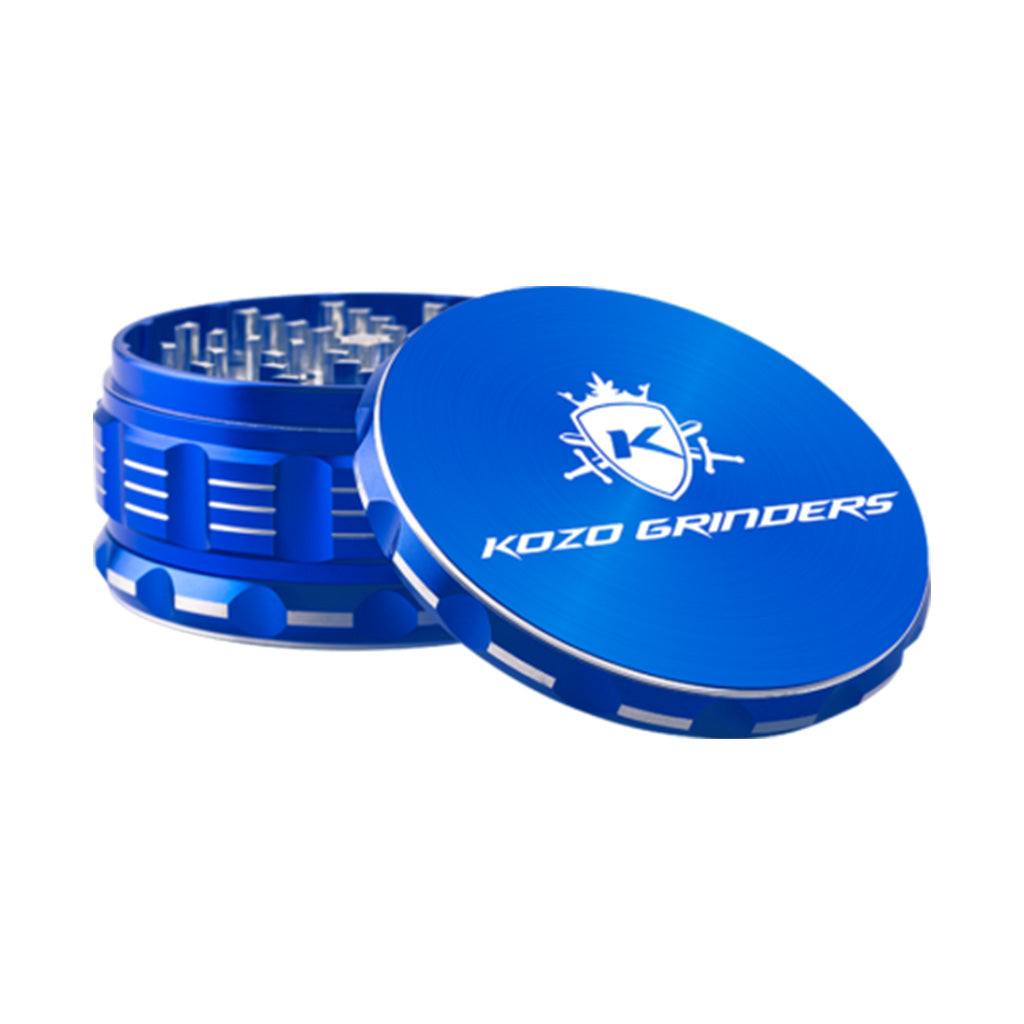 Kozo 4 inch four-piece anodized aluminum grinder in blue, lid tilted open beside the toothed grinding chamber