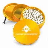 Kozo 4 inch four-piece anodized aluminum grinder in gold, split into four pieces with the pollen scraper