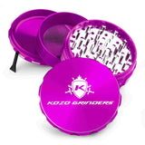 Kozo 4 inch four-piece anodized aluminum grinder in purple, split into four pieces with the pollen scraper