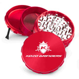 Kozo 4 inch four-piece anodized aluminum grinder in red, split into four pieces with the pollen scraper