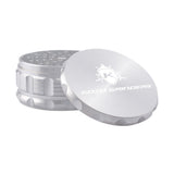 Kozo 4 inch four-piece anodized aluminum grinder in silver, lid tilted open beside the toothed grinding chamber