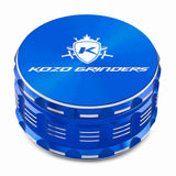 Kozo 4 inch four-piece anodized aluminum grinder in blue, closed front view of the body with the Kozo logo lid