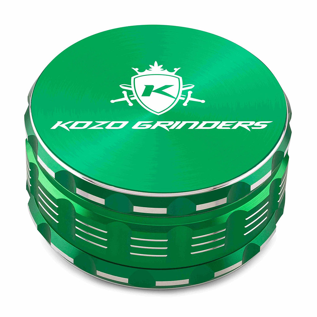 Kozo 4 inch four-piece anodized aluminum grinder in green, closed front view of the body with the Kozo logo lid