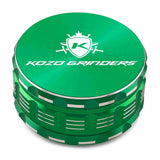 Kozo 4 inch four-piece anodized aluminum grinder in green, closed front view of the body with the Kozo logo lid