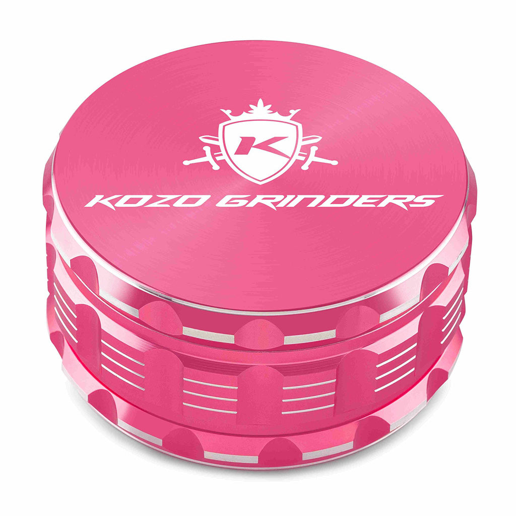 Kozo 4 inch four-piece anodized aluminum grinder in pink, closed front view of the body with the Kozo logo lid