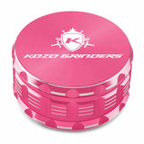 Kozo 4 inch four-piece anodized aluminum grinder in pink, closed front view of the body with the Kozo logo lid
