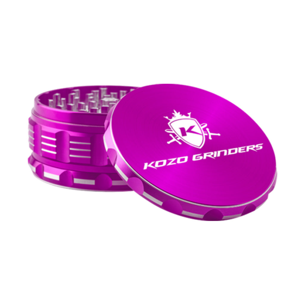 Kozo 4 inch four-piece anodized aluminum grinder in purple, lid tilted open beside the toothed grinding chamber