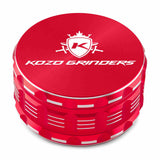 Kozo 4 inch four-piece anodized aluminum grinder in red, closed front view of the body with the Kozo logo lid