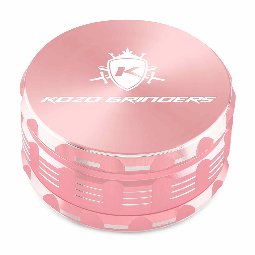 Kozo 4 inch four-piece anodized aluminum grinder in rose gold, closed front view of the body with the Kozo logo lid