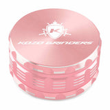 Kozo 4 inch four-piece anodized aluminum grinder in rose gold, closed front view of the body with the Kozo logo lid