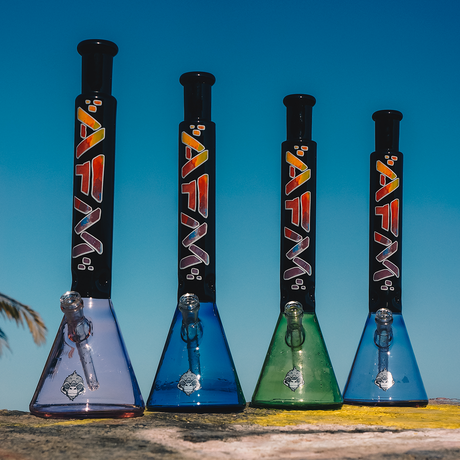 AFM Mind Expander Lime Glass Beaker Bongs in a row, showcasing color variants and showerhead perc