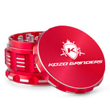 Kozo 3 inch aircraft-grade aluminum grinder in red, angled view with the lid tilted open and logo visible
