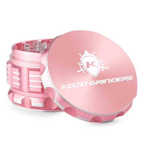 Kozo 3 inch aircraft-grade aluminum grinder in rose gold, angled view with the lid tilted open and logo visible
