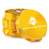 Kozo 2 inch aircraft-grade aluminum grinder in gold, angled view with the lid tilted open and logo visible