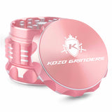 Kozo 2 inch aircraft-grade aluminum grinder in rose gold, angled view with the lid tilted open and logo visible