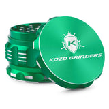 Kozo 2.5 inch aircraft-grade aluminum grinder in green, angled view with the lid tilted open and logo visible