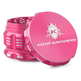 Kozo 2.5 inch aircraft-grade aluminum grinder in pink, angled view with the lid tilted open and logo visible