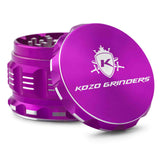 Kozo 2.5 inch aircraft-grade aluminum grinder in purple, angled view with the lid tilted open and logo visible