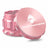 Kozo 2.5 inch aircraft-grade aluminum grinder in rose gold, angled view with the lid tilted open and logo visible