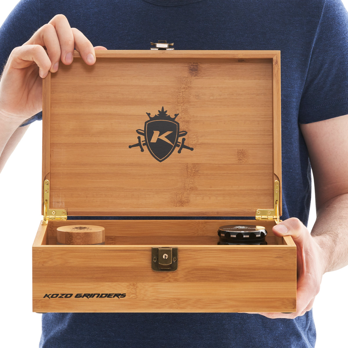 Kozo XL bamboo stash box set with hinged lid held open by a person, filled with the full kit