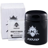 Kozo 1/2 oz black UV glass storage jar with airtight lid, shown beside its white retail box