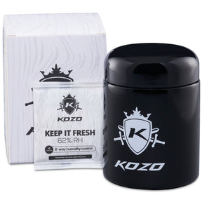 Kozo 1/2 oz black UV glass storage jar with airtight lid, shown beside its white retail box
