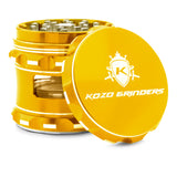 Kozo 2.5 inch window grinder in gold, angled view with the lid tilted open and side window visible