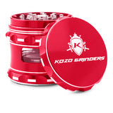 Kozo 2.5 inch window grinder in red, angled view with the lid tilted open and side window visible