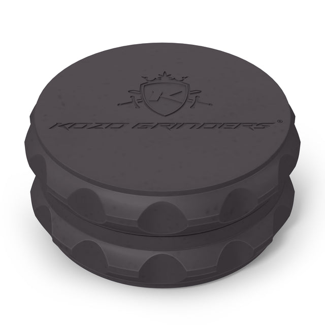 Kozo 2.5 inch two-piece hemp grinder in black, closed view of the matte textured body with the Kozo logo on the lid