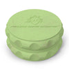 Kozo 2.5 inch two-piece hemp grinder in green, closed view of the matte textured body with the Kozo logo on the lid