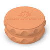 Kozo 2.5 inch two-piece hemp grinder in orange, closed view of the matte textured body with the Kozo logo on the lid