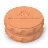 Kozo 2.5 inch two-piece hemp grinder in orange, closed view of the matte textured body with the Kozo logo on the lid
