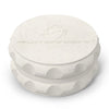 Kozo 2.5 inch two-piece hemp grinder in white, closed view of the matte textured body with the Kozo logo on the lid