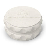 Kozo 2.5 inch two-piece hemp grinder in white, closed view of the matte textured body with the Kozo logo on the lid