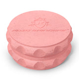 Kozo 2.5 inch two-piece hemp grinder in pink, closed view of the matte textured body with the Kozo logo on the lid