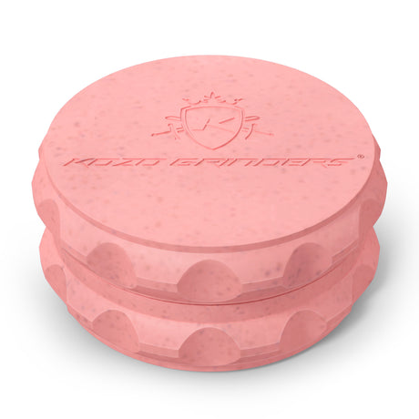 Kozo 2.5 inch two-piece hemp grinder in pink, closed view of the matte textured body with the Kozo logo on the lid