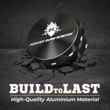 Kozo 2.5 inch two-piece non-stick aluminum grinder in black on cracked stone with a Build to Last aluminum callout