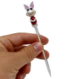 Hand holding AFM Bunny Glass Dabber Tool with detailed colored glass design, perfect for dab rigs