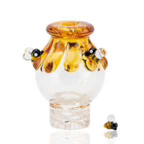 Empire Glassworks Beehive Spinner Cap with intricate honey drip design, front view on white background