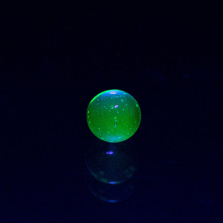 Empire Glassworks Siriusly Shrooms Spinner Cap glowing in dark, borosilicate glass